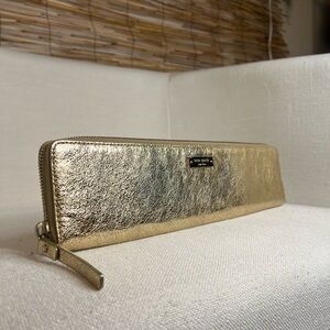 K A T E   S P A D E.    Gold wallet. 3” x 13”